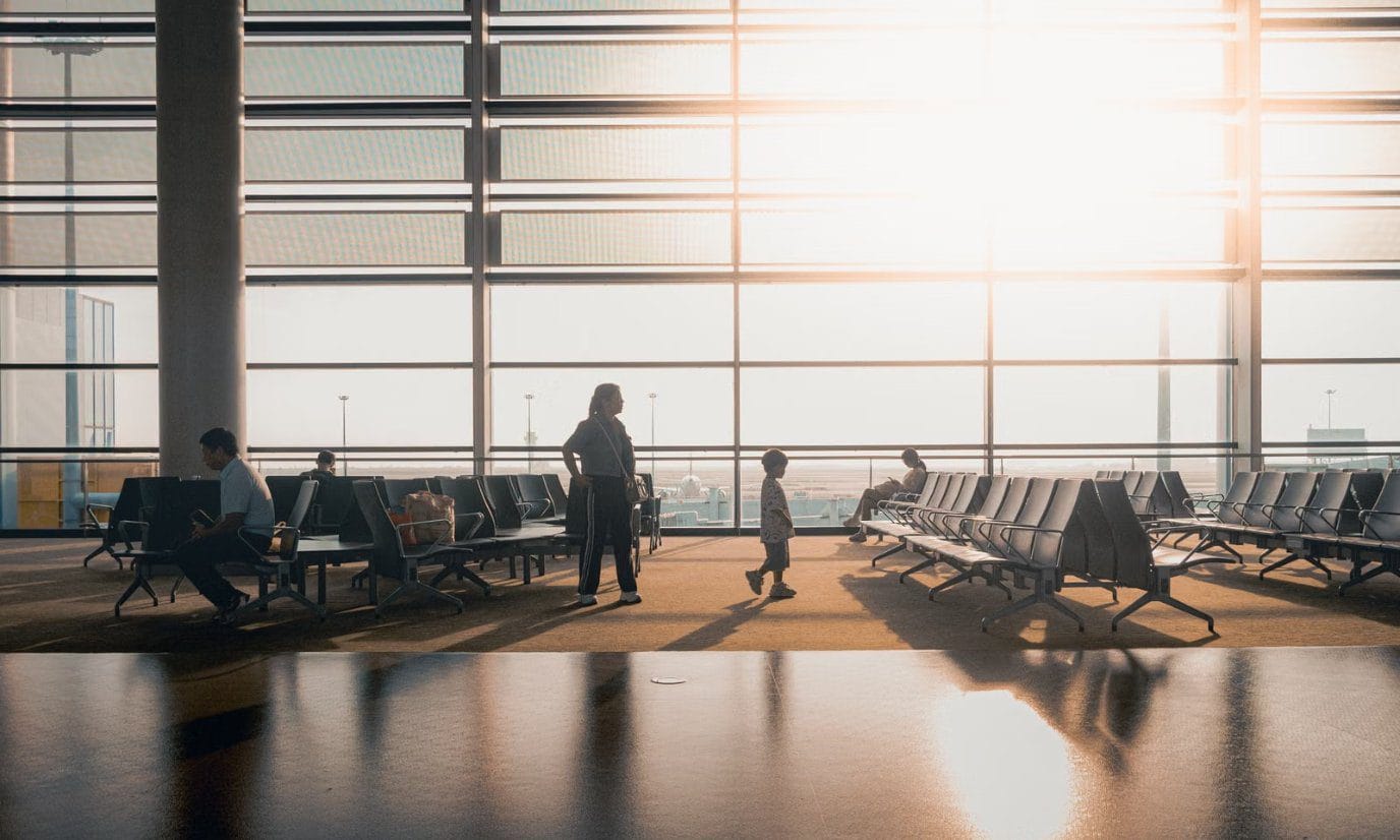 Morning light through the windows of an airport departure lounge