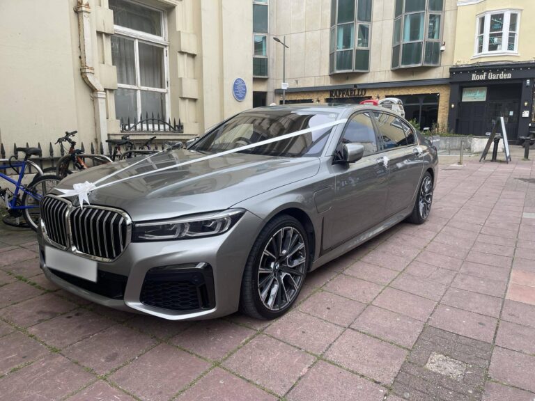 Our BMW 7 Series wedding car dressed with white ribbons