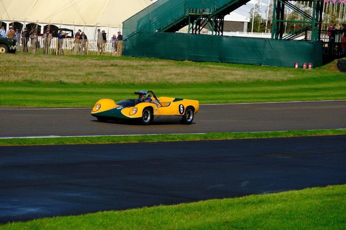 A vintage racing car on track at Goodwood Motor Circuit in West Sussex