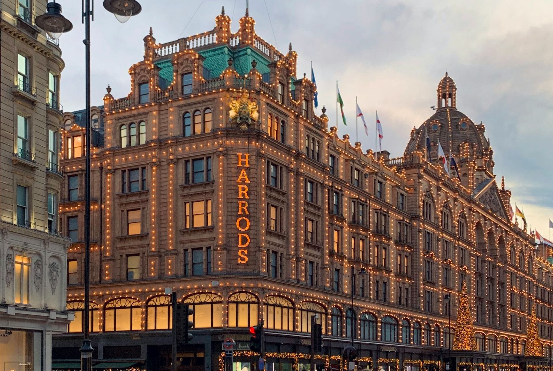 Harrods in Knightsbridge, London, with its lights on