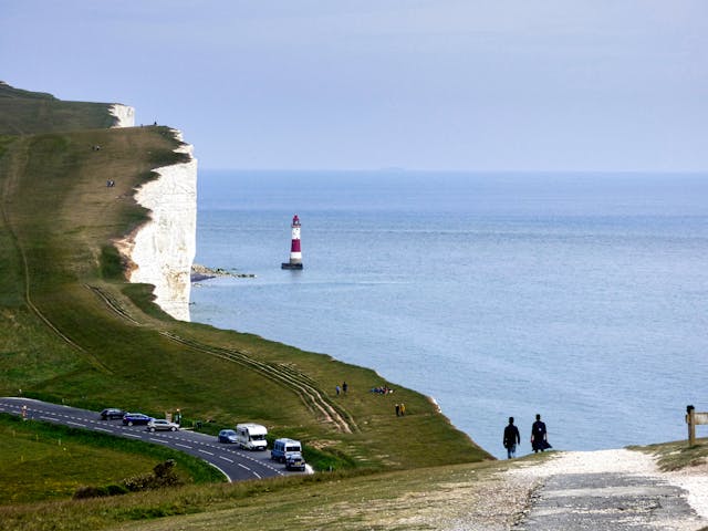 Scenic view of the white cliffs and lighthouse, perfect for bespoke private chauffeur tours.